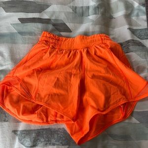 Lululemon 4” neon orange Hotty hots in size 0!!